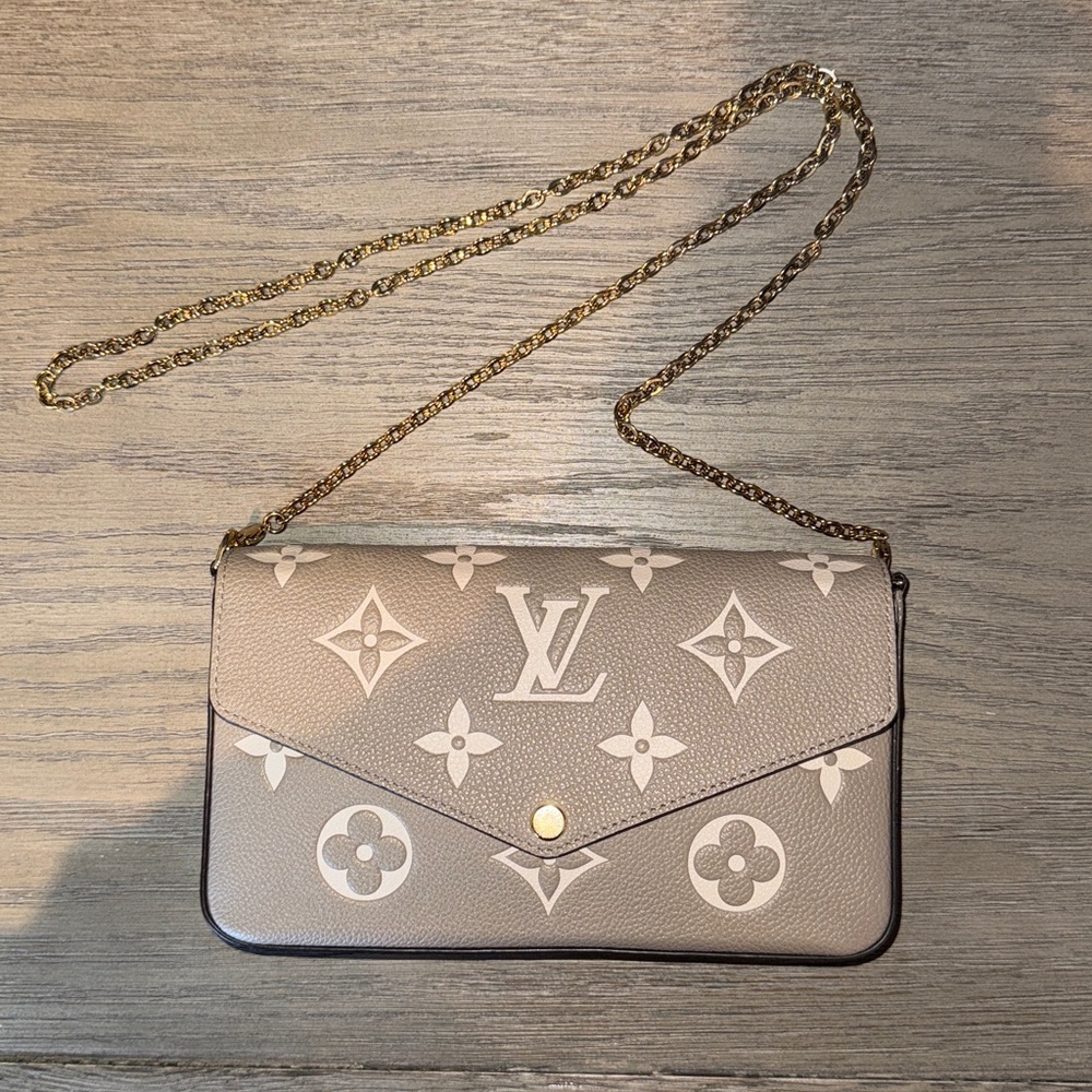 Louis Vuitton bicolor Empreinte pochette Felicie M69977. Brown bi color